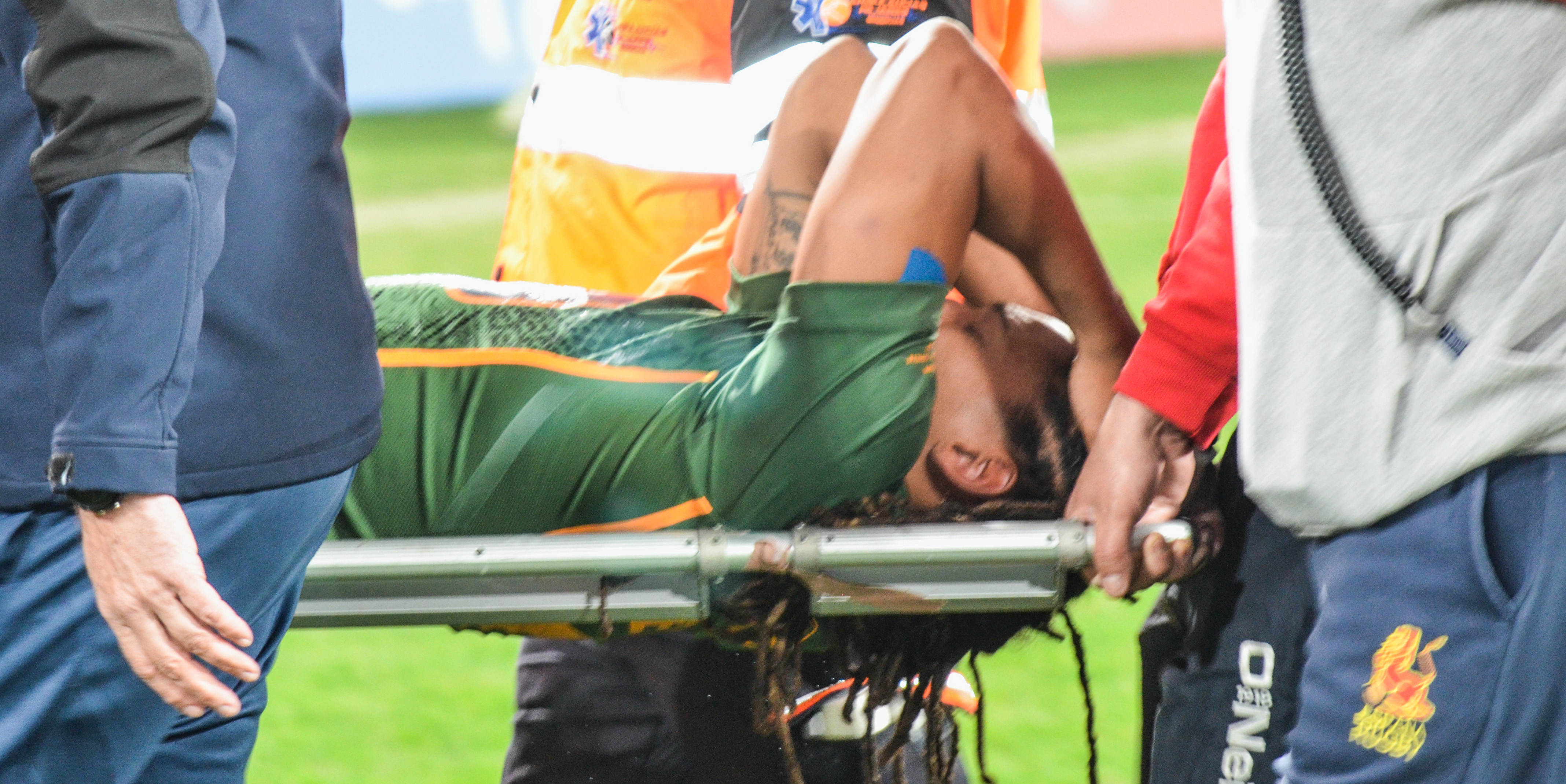 Justin Geduld is carried off the field in Seville last January after seriously injuring his knee.