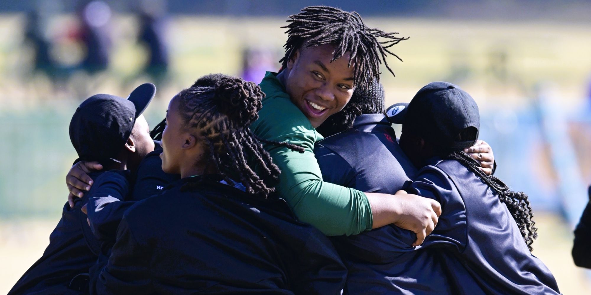 Babalwa Latsha scrums down with a bunch of girls in Johannesburg.