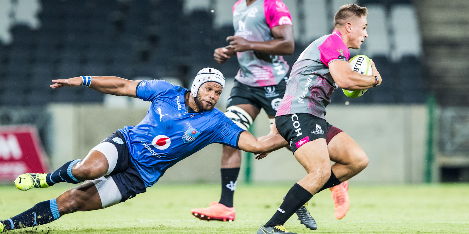 Vodacom Bulls captain Nizaam Carr tries to stop Sebastiaan de Klerk of the New Nation Pumas.