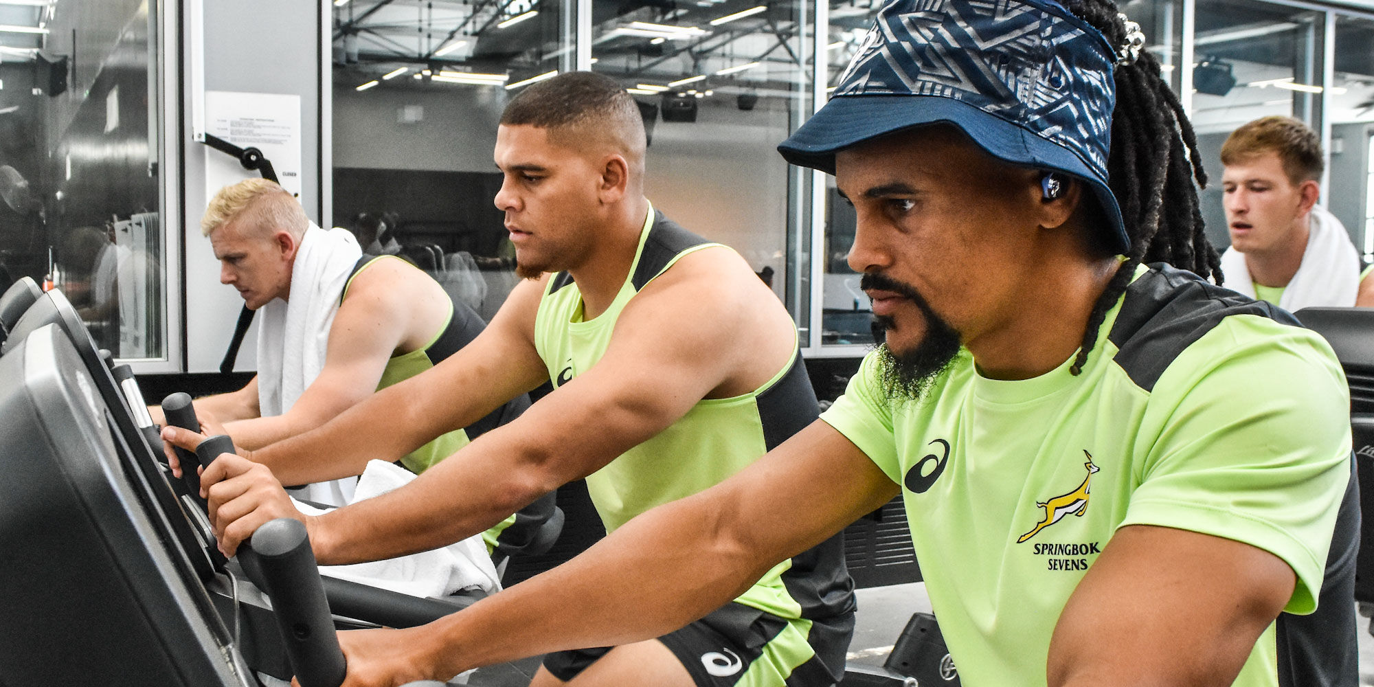 Ryan Oosthuizen, Zain and Selvyn Davids sweat it out in the gym in Hamilton.